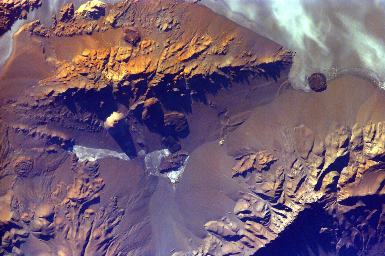 The Andes Mountains, part of the Southern Cordillera formed from subduction zone volcanism at the convergent boundary of the Nazca plate and the South American plate. This image is from NASA EarthKAM.