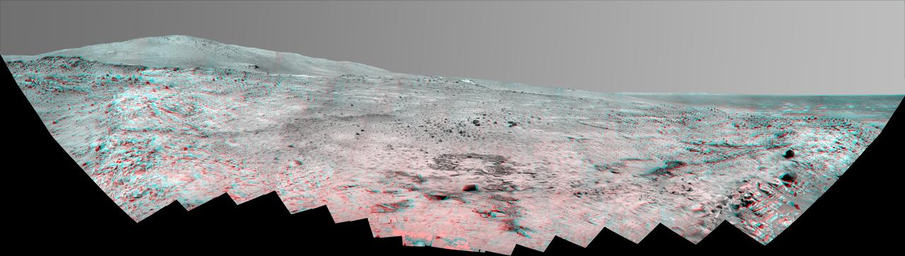 This stereo, 180-degree panorama shows the southward vista from the location where Spirit is spending its third Martian winter inside Mars Gusev Crater on July 2, 2008. 3D glasses are necessary to view this image.