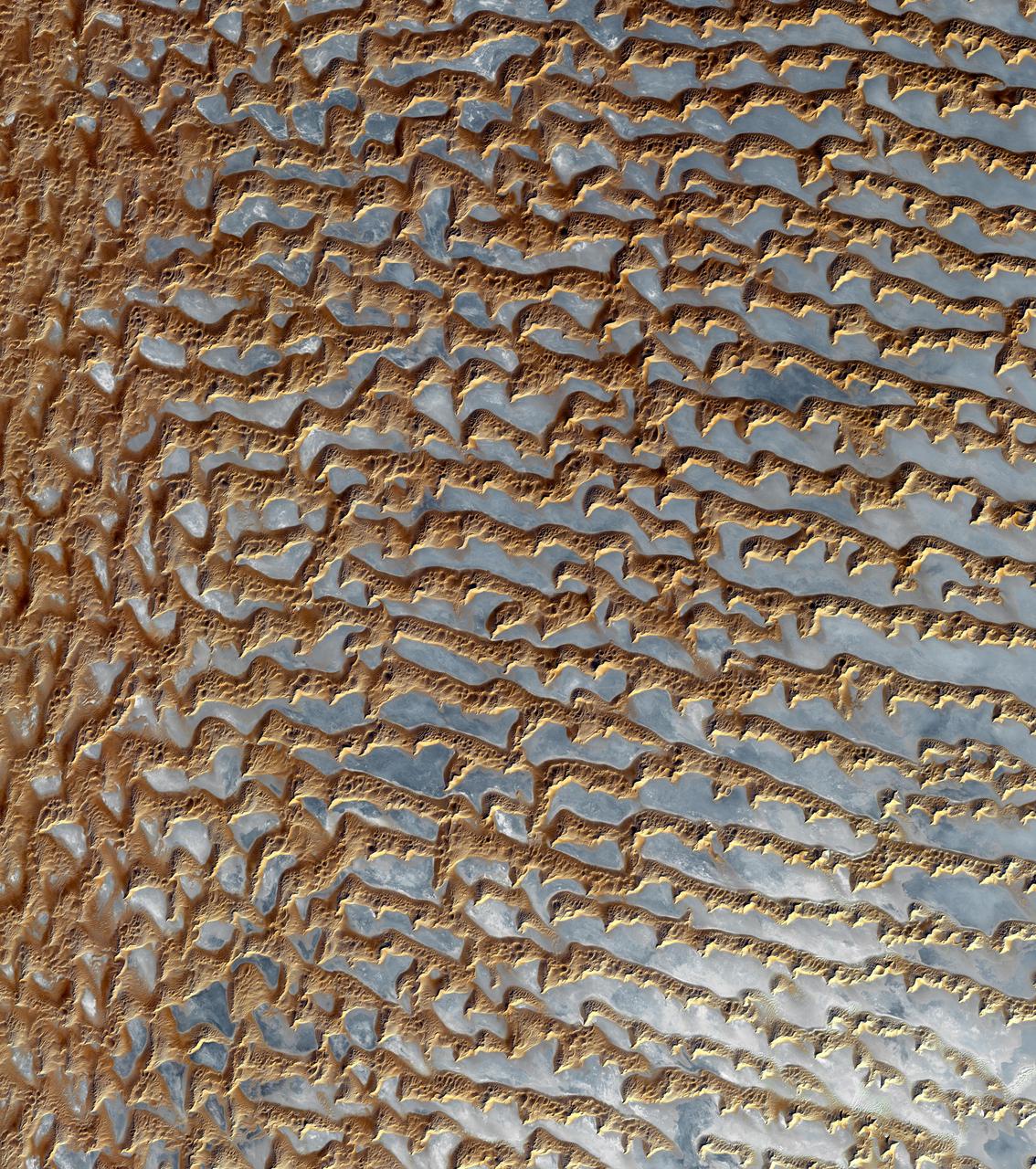 NASA Terra spacecraft shows the Rub al Khali, one of the largest sand deserts in the world, encompassing most of the southern third of the Arabian Peninsula; it includes parts of Oman, United Arab Emirates, and Yemen.
