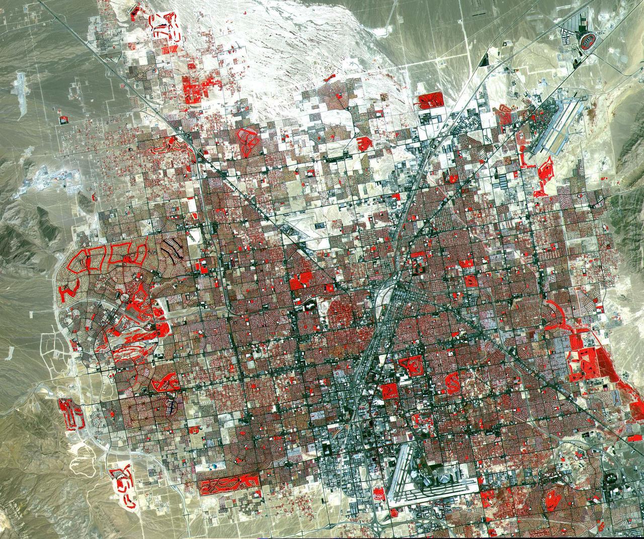 This image of Las Vegas, NV was acquired on August, 2000 and covers an area 42 km (25 miles) wide and 30 km (18 miles) long. The image displays three bands of the reflected visible and infrared wavelength region, with a spatial resolution of 15 m. McCarran International Airport to the south and Nellis Air Force Base to the NE are the two major airports visible. Golf courses appear as bright red areas of worms. The first settlement in Las Vegas (which is Spanish for The Meadows) was recorded back in the early 1850s when the Mormon church, headed by Brigham Young, sent a mission of 30 men to construct a fort and teach agriculture to the Indians. Las Vegas became a city in 1905 when the railroad announced this city was to be a major division point. Prior to legalized gambling in 1931, Las Vegas was developing as an agricultural area. Las Vegas' fame as a resort area became prominent after World War II. The image is located at 36.1 degrees north latitude and 115.1 degrees west longitude.  http://photojournal.jpl.nasa.gov/catalog/PIA11096