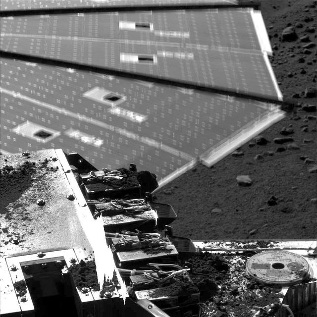 NASA image: Solar Panel Buffeted by Wind at Phoenix Site