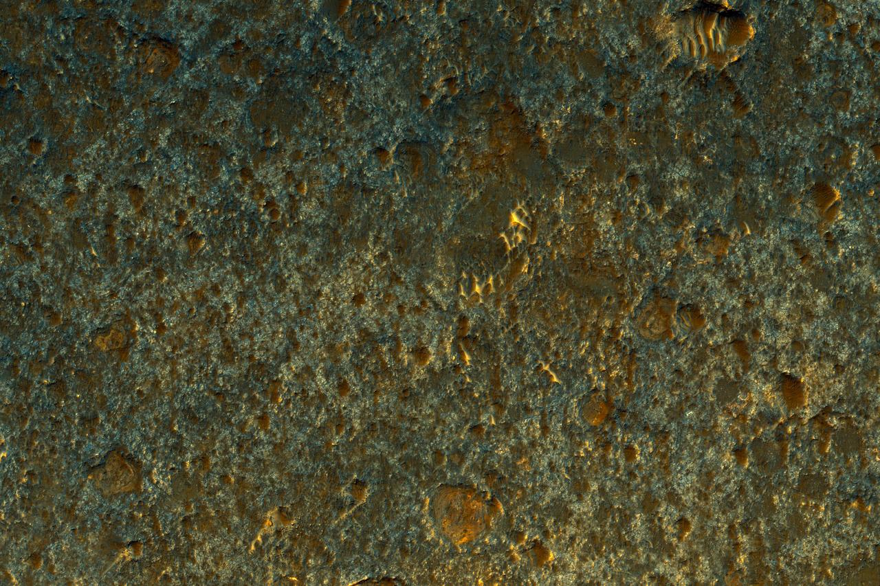 NASA Mars Reconnaissance Orbiter observed a small portion of a dark crater floor in the Tyrrhena Terra region of Mars. This is largely ancient hard bedrock that has been cratered by numerous impacts over the eons.  http://photojournal.jpl.nasa.gov/catalog/PIA11179