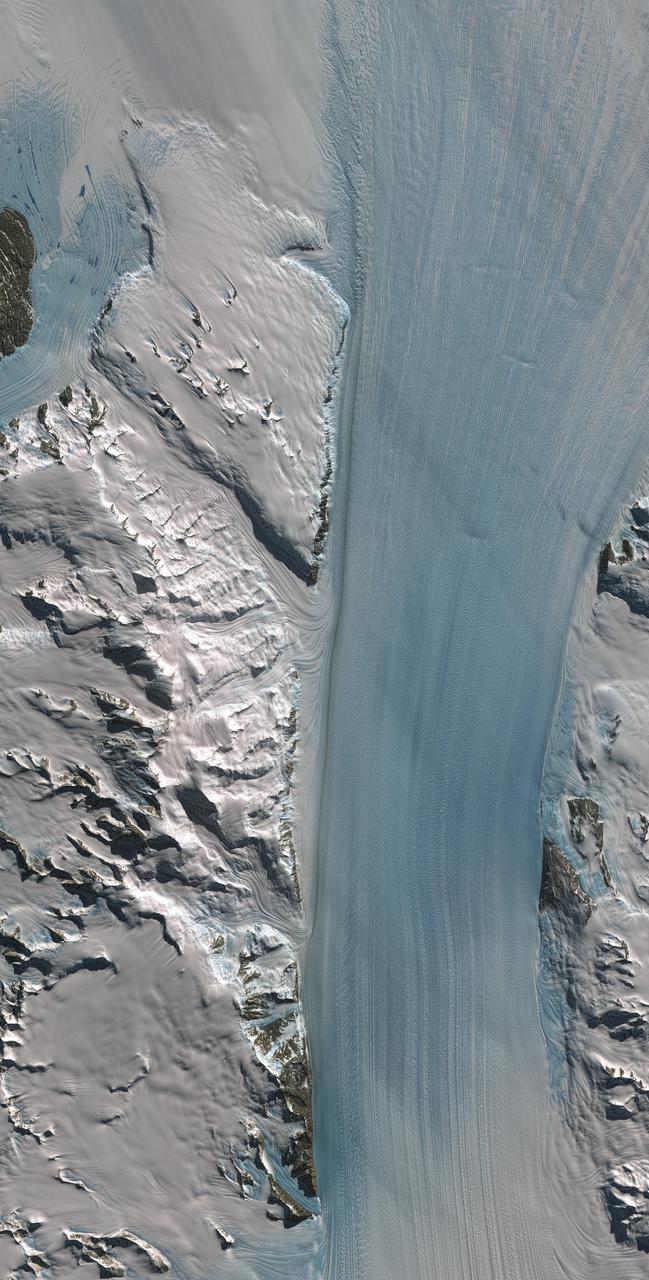 Byrd Glacier is a major glacier in Antarctica; it drains an extensive area of the polar plateau and flows eastward between the Britannia Range and the Churchill Mountains to discharge into the Ross Ice Shelf. This image is from NASA Terra satellite.