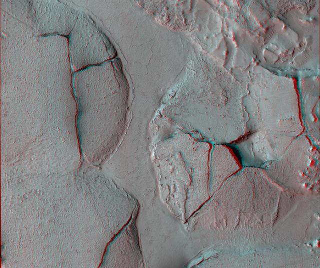This stereo view shows fractured mounds on the southern edge of Elysium Planitia on Mars. It combines two images from NASA Mars Reconnaissance Orbiter. 3D glasses are necessary to view this image.