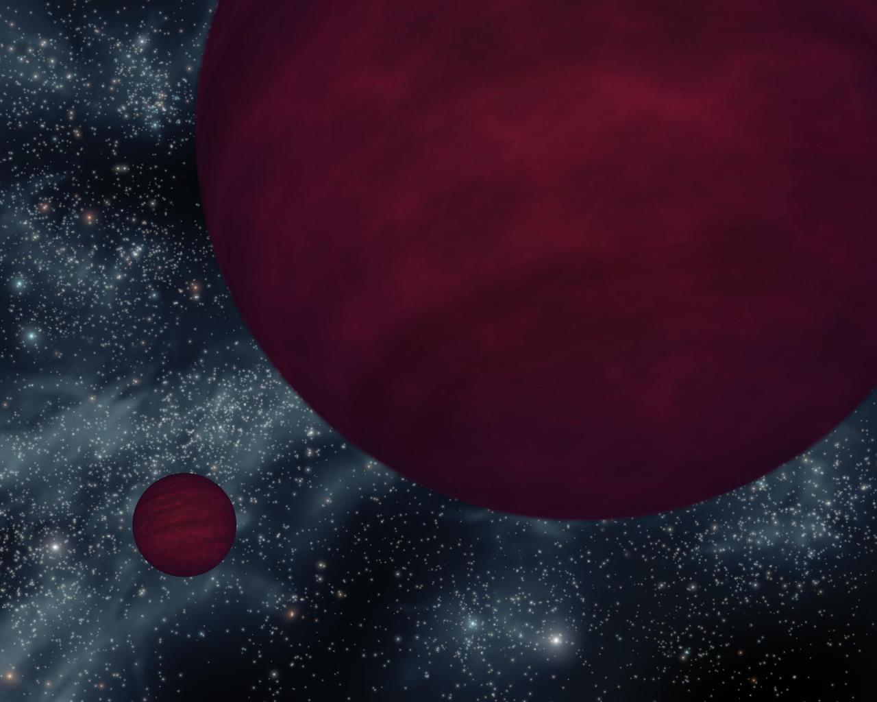This artist concept based on data from NASA Spitzer shows the dimmest star-like bodies currently known -- twin brown dwarfs referred to as 2M 0939. The twins, which are about the same size, are drawn as if they were viewed close to one of the bodies.