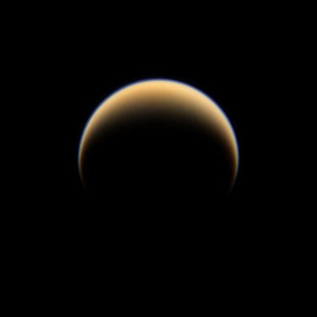 The Cassini spacecraft looks down on the north pole of Titan, showing night and day in the northern hemisphere of Saturn largest moon.