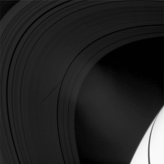 The shadow of the moon Epimetheus crosses Saturn rings in this image taken as the planet approached its August 2009 equinox.