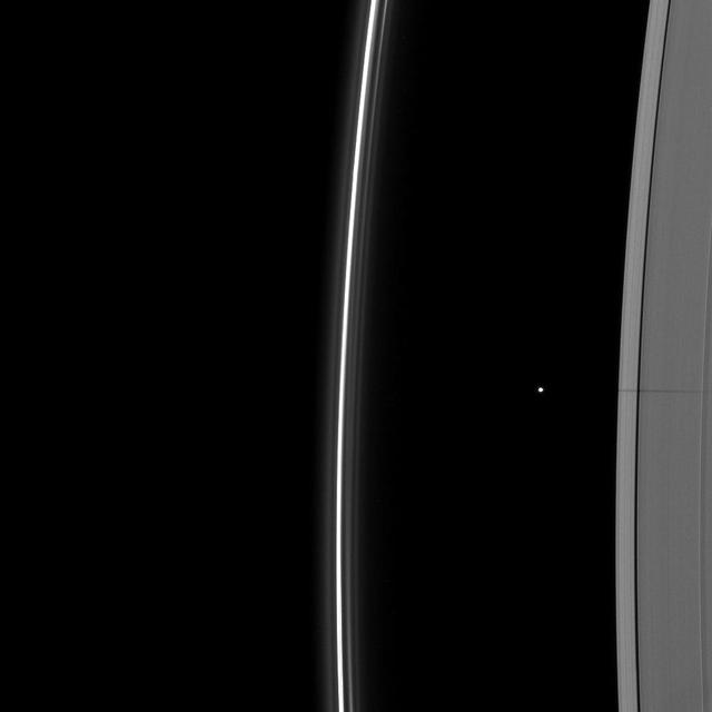 The shadow of the moon Janus dwarfs the shadow of Daphnis on Saturn A ring in this image taken as the planet approached its August 2009 equinox.