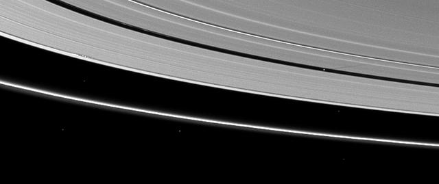 Moon shadows are cast on Saturn A ring in this image taken by NASA Cassini Orbiter almost a month after the planet August 2009 equinox.