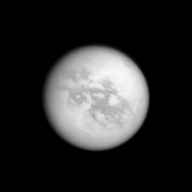 In the top right of NASA Cassini image, the southern end of Titan huge lake of liquid hydrocarbons called Kraken Mare is visible near the moon north pole.
