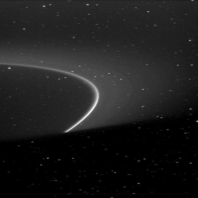 The bright arc within Saturn G ring is shown truncated by the shadow of the planet at the bottom of this image captured by NASA Cassini spacecraft.