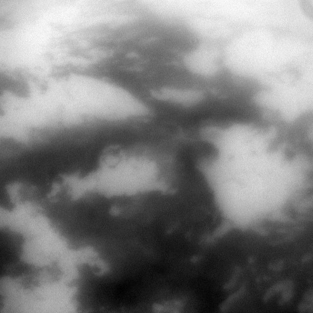 The low albedo feature known as Senkyo is visible through the haze of Titan atmosphere in this image captured by NASA Cassini spacecraft.