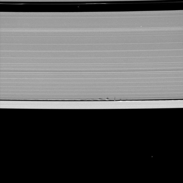 NASA image: Tiny Moon, Looming Shadows