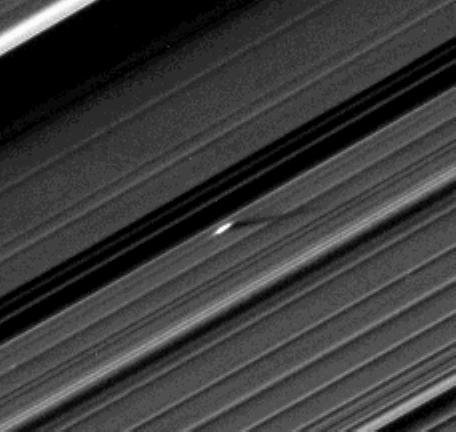 An unusually large propeller feature is detected just beyond the Encke Gap in this Cassini image of Saturn’s outer A ring taken a couple days after the planet’s August 2009 equinox.