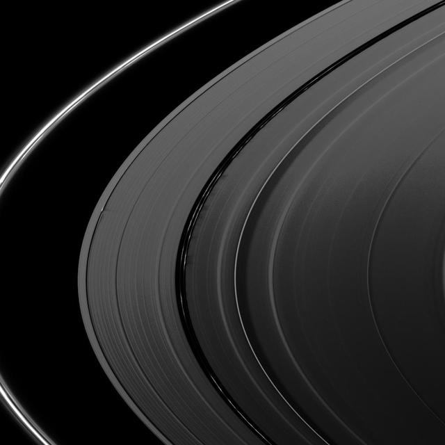 Several sets of shadows are cast onto the A ring in this image taken by NASA Cassini Orbiter about a week after Saturn’s August 2009 equinox.