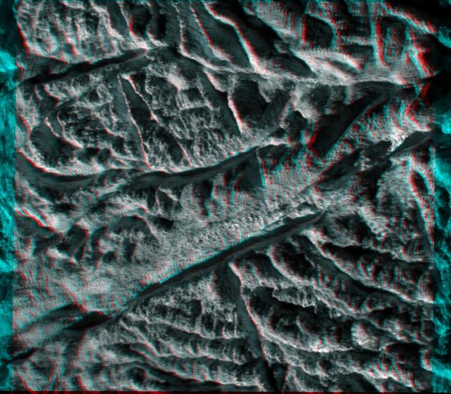 This anaglyph from images captured by NASA Cassini spacecraft shows a dramatic, 3-D view of one of the deep fractures nicknamed tiger stripes on Saturn moon Enceladus which are located near the moon south pole, spray jets of water ice.