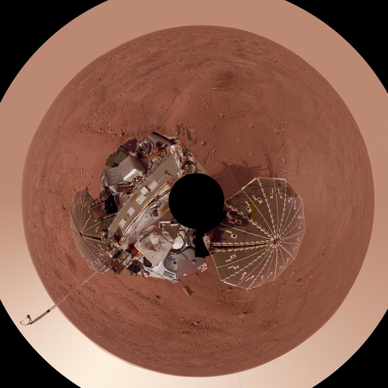 This view is a polar projection that combines more than 500 exposures taken by the Surface Stereo Imager camera on NASA Mars Phoenix Lander and projects them as if looking down from above.
