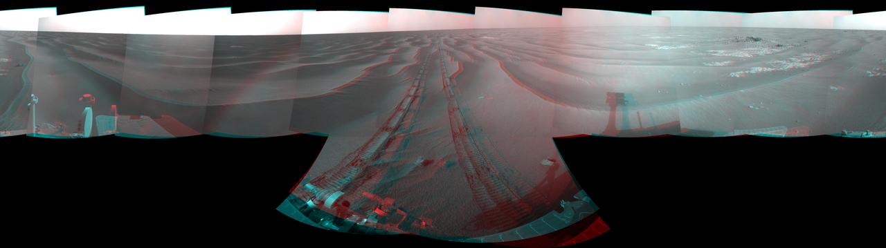 NASA Mars Exploration Rover Opportunity used its navigation camera to take the images combined into this stereo 180-degree view on March 5, 2009. 3D glasses are necessary to view this image.