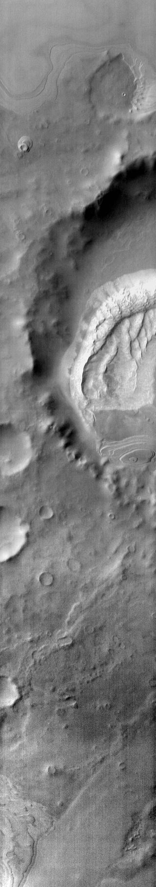 Many craters around the south polar cap contain dune fields on their floors. This is one example of such a crater. This image was taken with the 2001 Mars Odyssey THEMIS infrared camera and shows the warm daytime temperature of the dunes.