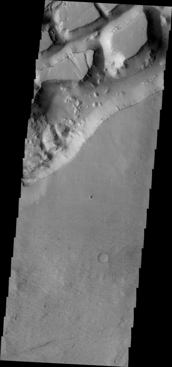 This 2001 Mars Odyssey THEMIS VIS image of the western portion of Sirenum Fossae shows mesa formation.