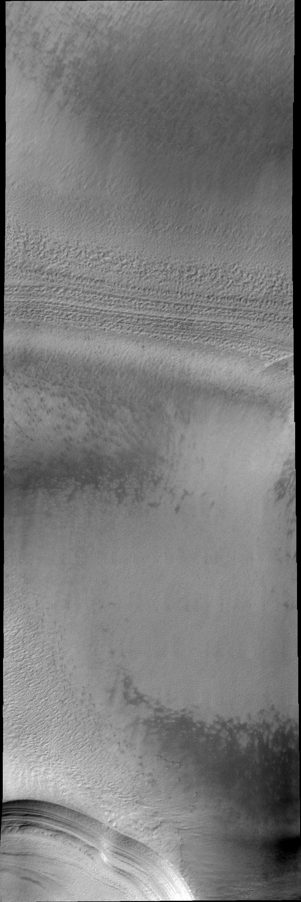 The numerous layers of the south polar cap are shown in cross-section in this 2001 Mars Odyssey THEMIS VIS image.