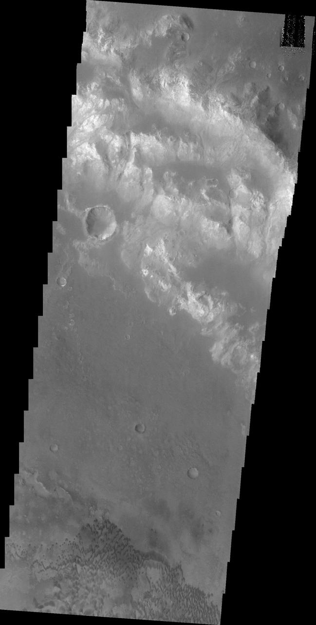This image of Holden Crater shows some of the small dark dunes located on the floor of the crater.
