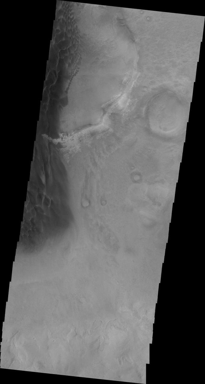 This 2001 Mars Odyssey image shows the eastern margin of the sand sheet and dune field on the floor of Rabe Crater.