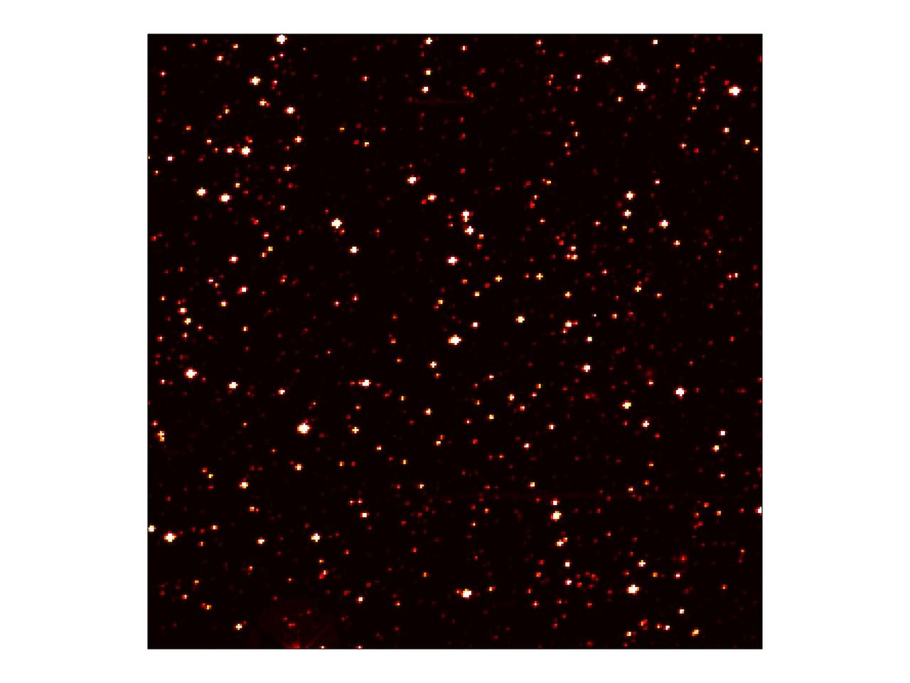 This image zooms into a small portion of NASA Kepler full field of view -- an expansive, 100-square-degree patch of sky in our Milky Way galaxy. At the center of the field is a star with a known "hot Jupiter" planet, named "TrES-2," zipping closely around it every 2.5 days. Kepler will observe TrES-2 and other known planets as a test to demonstrate that it is working properly, and to obtain new information about those planets. The area pictured is one-thousandth of Kepler's full field of view, and shows hundreds of stars at the very edge of the constellation Cygnus. The image has been color-coded so that brighter stars appear white, and fainter stars, red. It is a 60-second exposure, taken on April 8, 2009, one day after the spacecraft's dust cover was jettisoned. Kepler was designed to hunt for planets like Earth. The mission will spend the next three-and-a-half years staring at the same stars, looking for periodic dips in brightness. Such dips occur when planets cross in front of their stars from our point of view in the galaxy, partially blocking the starlight. To achieve the level of precision needed to spot planets as small as Earth, Kepler's images are intentionally blurred slightly. This minimizes the number of saturated stars. Saturation, or "blooming," occurs when the brightest stars overload the individual pixels in the detectors, causing the signal to spill out into nearby pixels. http://photojournal.jpl.nasa.gov/catalog/PIA11985