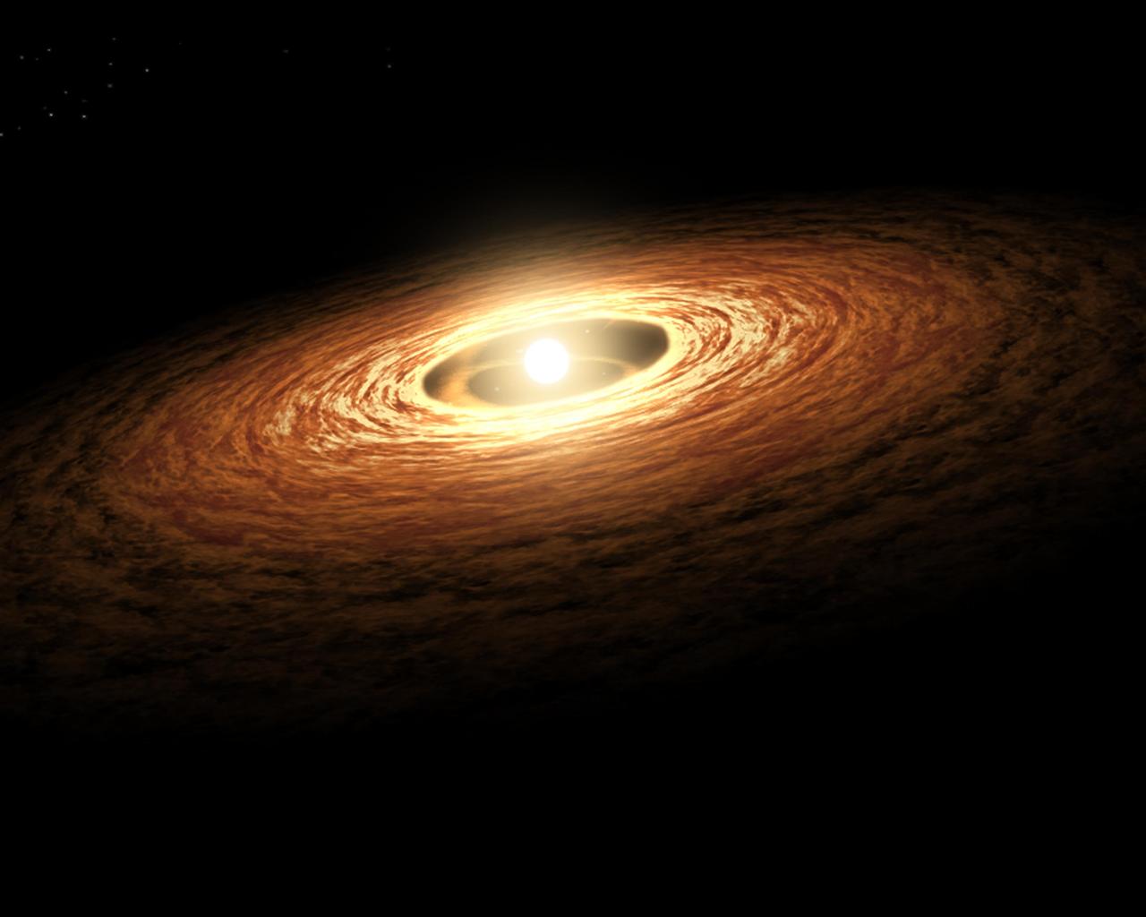 This artist's concept illustrates how silicate crystals like those found in comets can be created by an outburst from a growing star. The image shows a young sun-like star encircled by its planet-forming disk of gas and dust. The silicate that makes up most of the dust would have begun as non-crystallized, amorphous particles.  Streams of material are seen spiraling from the disk onto the star increasing its mass and causing the star to brighten and heat up dramatically. The outburst causes temperatures to rise in the star's surrounding disk.  The animation (figure 1) zooms into the disk to show close-ups of silicate particles. When the disk warms from the star's outburst, the amorphous particles of silicate melt. As they cool off, they transform into forsterite (figure 2), a type of silicate crystal often found in comets in our solar system.  In April 2008, NASA's Spitzer Space Telescope detected evidence of this process taking place on the disk of a young sun-like star called EX Lupi.   http://photojournal.jpl.nasa.gov/catalog/PIA12008
