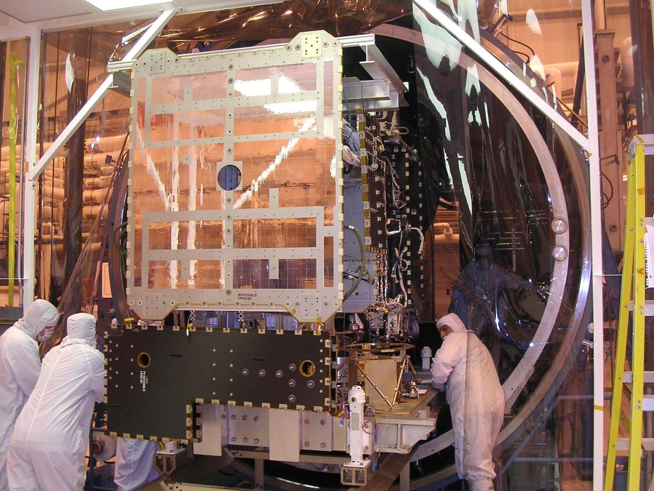 NASA Dawn spacecraft being moved into thermal vacuum chamber for bake-out.