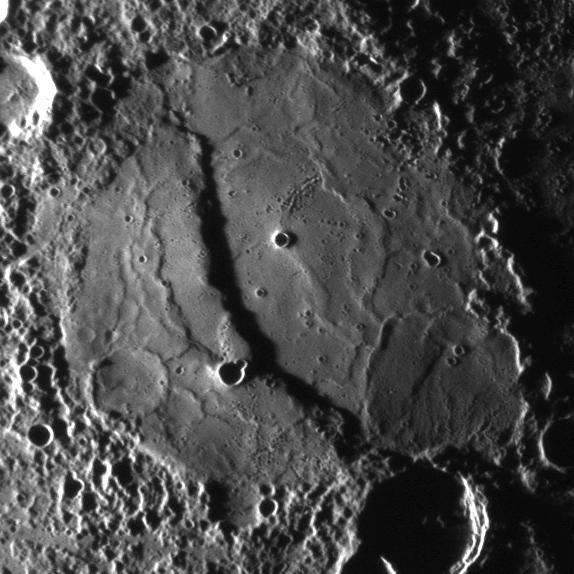 The scarp cutting through this crater was imaged as NASA MESSENGER approached the planet during the mission second Mercury flyby.