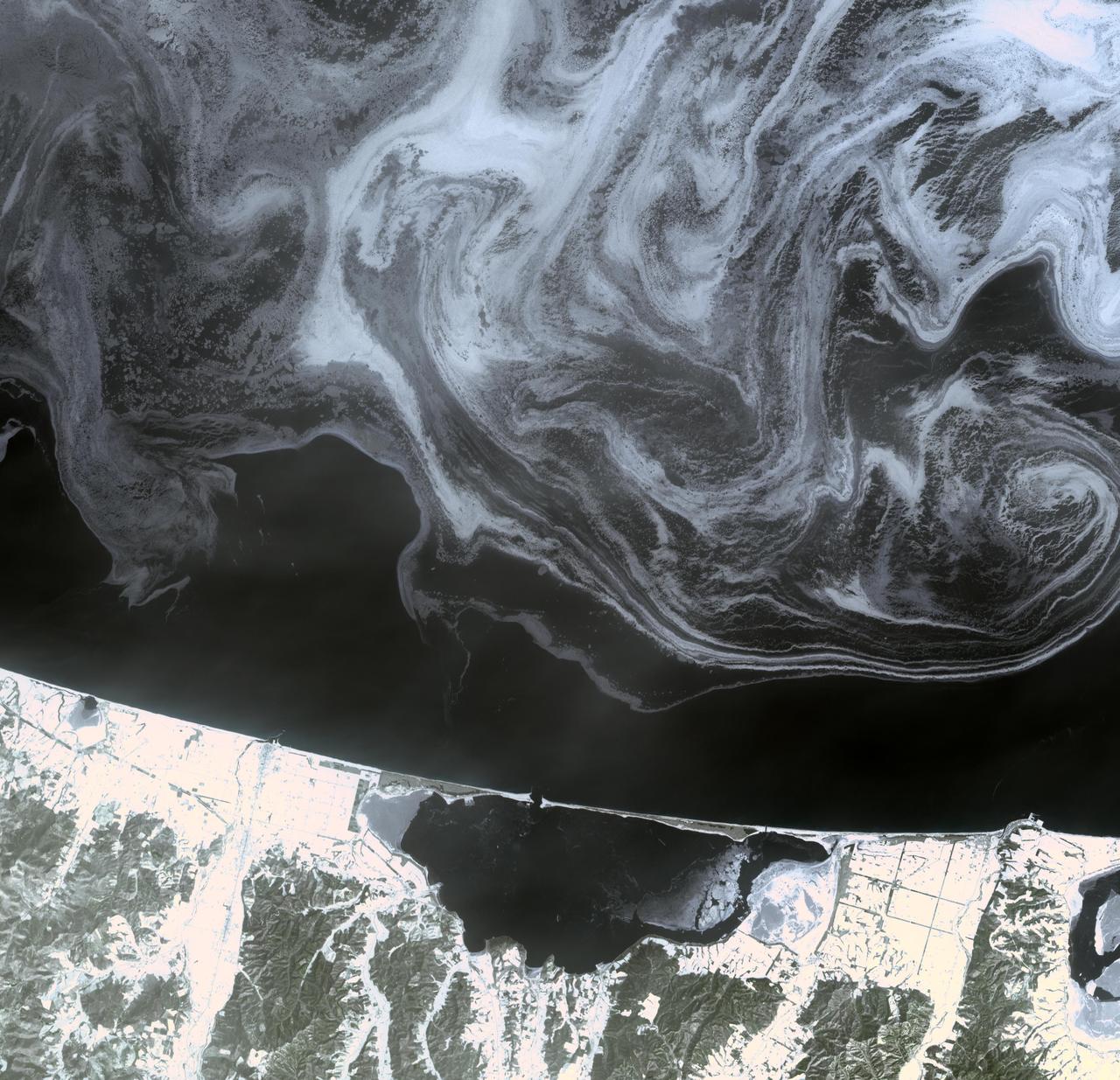 The north coast of the Island of Hokkaido, Japan lies at the southern end of the Sea of Okhotsk. NASA Terra spacecraft acquired this image on February 11, 2009.