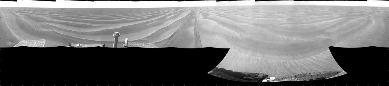 NASA Opportunity had driven 72.3 meters southward 237 feet that sol. Engineers drove the rover backward as a strategy to counteract an increase in the amount of current drawn by the drive motor of the right-front wheel. This is a cylindric projection.
