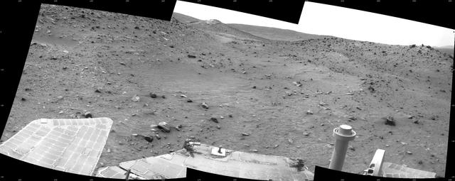 This scene combines three frames taken by the navigation camera on NASA Mars Exploration Rover Spirit during the 1,869th Martian day, or sol, of Spirit mission on Mars April 6, 2009. It spans 120 degrees, with south at the center.