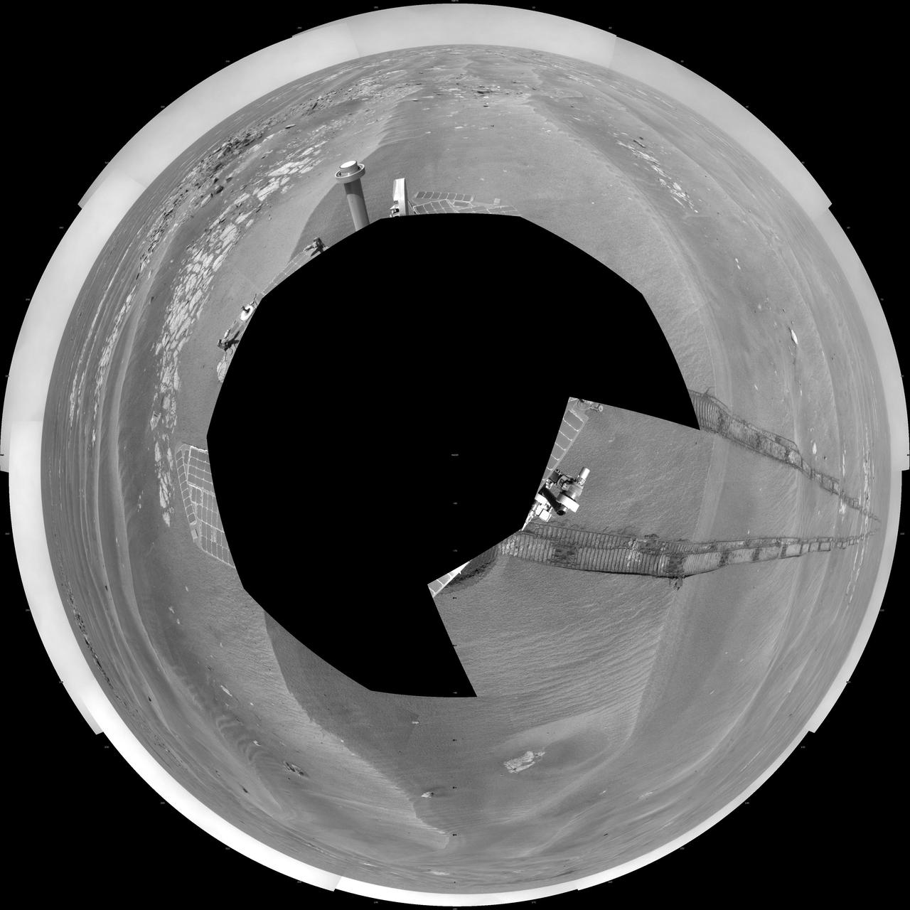 NASA Mars Exploration Rover Opportunity used its navigation camera to take the images combined into this 360-degree polar view of the rover surroundings on the 1,950th Martian day, or sol, of its surface mission July 19, 2009.