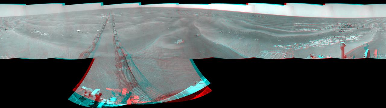 NASA Mars Exploration Rover Opportunity used its navigation camera to take the images combined into this 360-degree stereo view of the rover surroundings on July 19, 2009. 3D glasses are necessary to view this image.