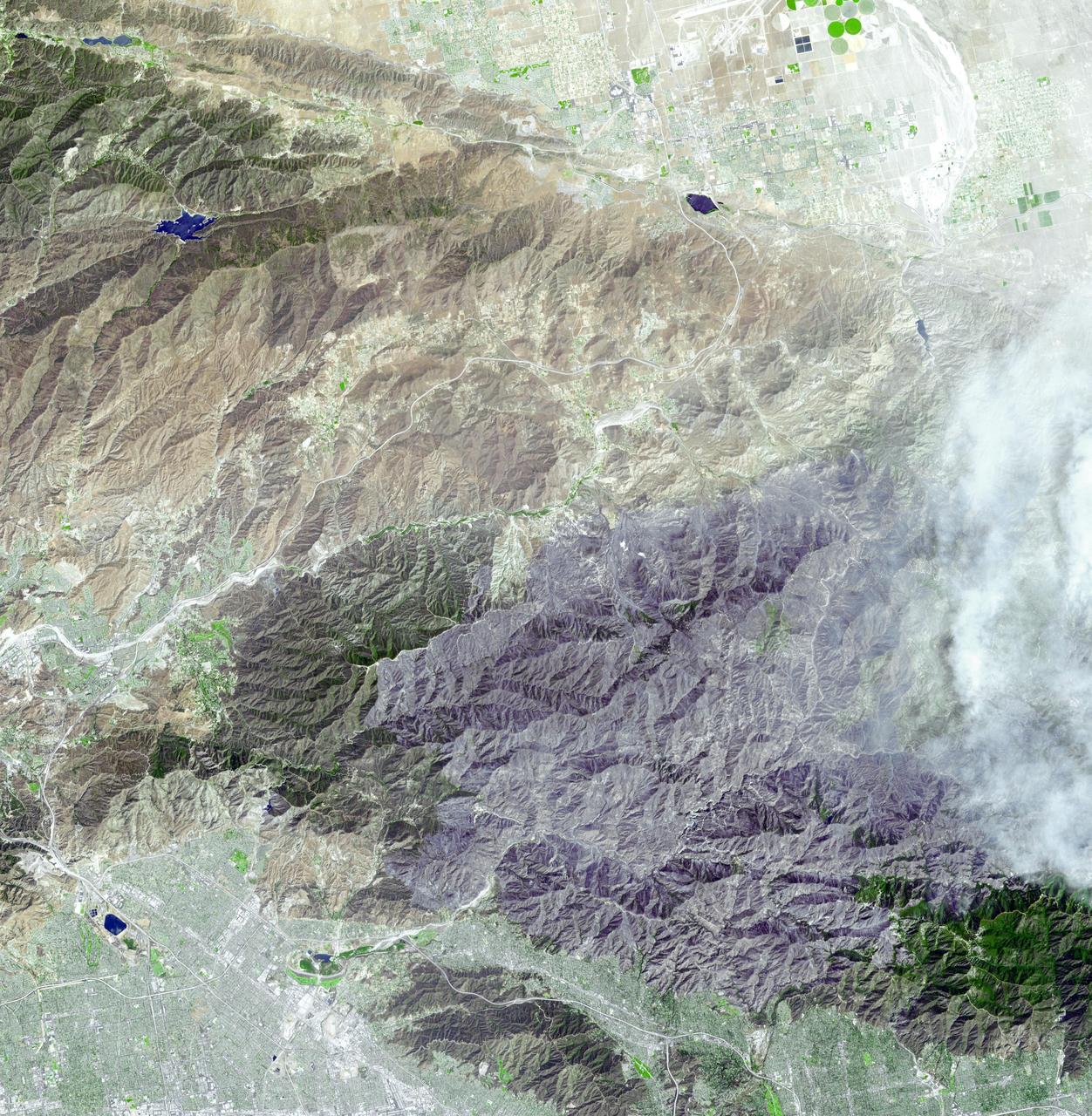 JPL Advanced Spaceborne Thermal Emission and Reflection Radiometer aboard NASA Terra satellite captured this simulated natural color image of the Station fire, burning in the San Gabriel Mountains.