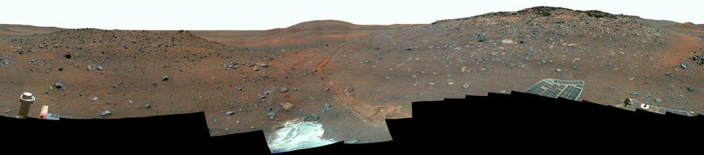 This full-circle, false color view from the panoramic camera Pancam on NASA Mars Exploration Rover Spirit shows the terrain surrounding the location called Troy, where Spirit became embedded in soft soil during the spring of 2009.