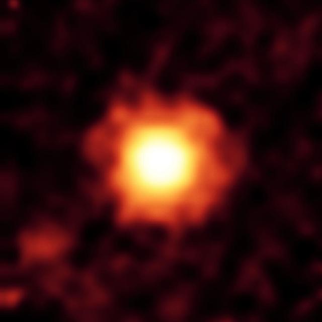 NASA Spitzer Space Telescope captured this infrared image of a giant halo of very fine dust around the young star HR 8799, located 129 light-years away in the constellation Pegasus.