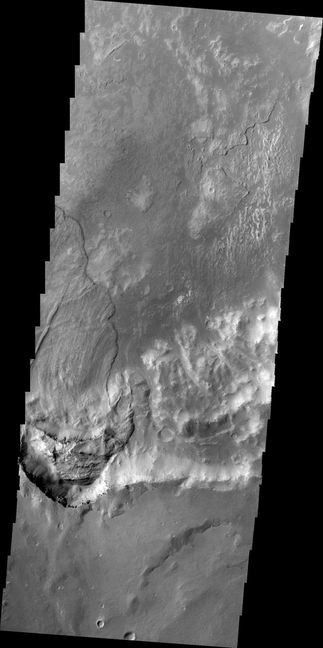 This image, taken by NASA 2001 Mars Odyssey spacecraft, shows a large landslide deposit in an unnamed crater southwest of Holden Crater.