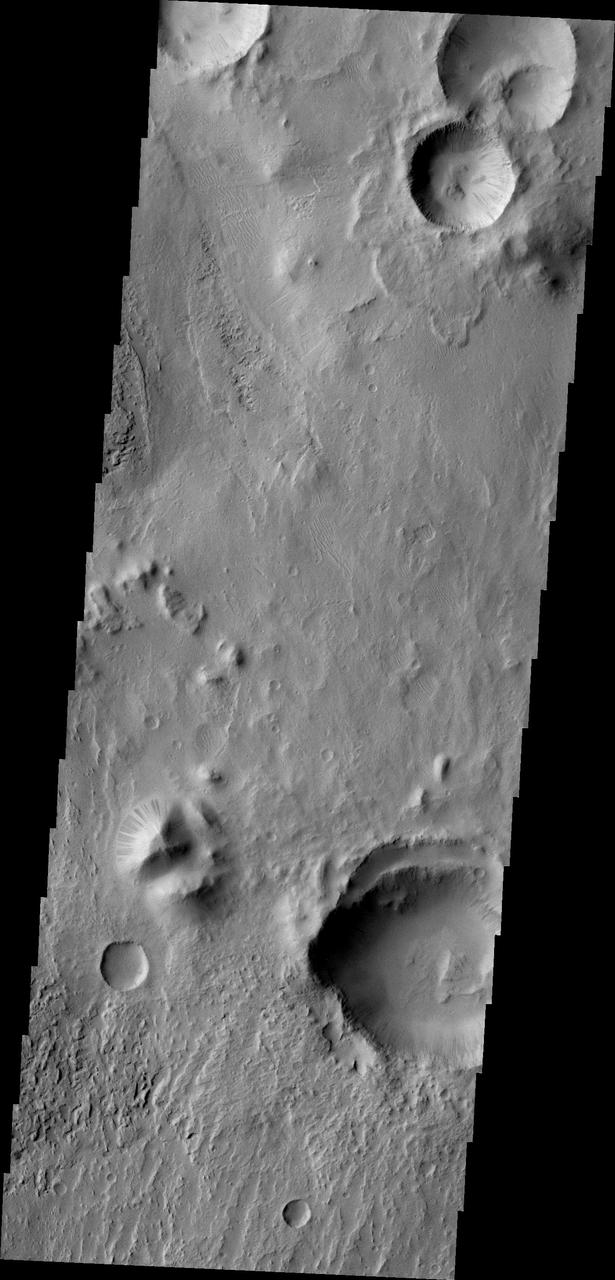 NASA 2001 Mars Odyssey spacecraft captured numerous dark slope streaks in this small unnamed crater in Zephyria Planum.