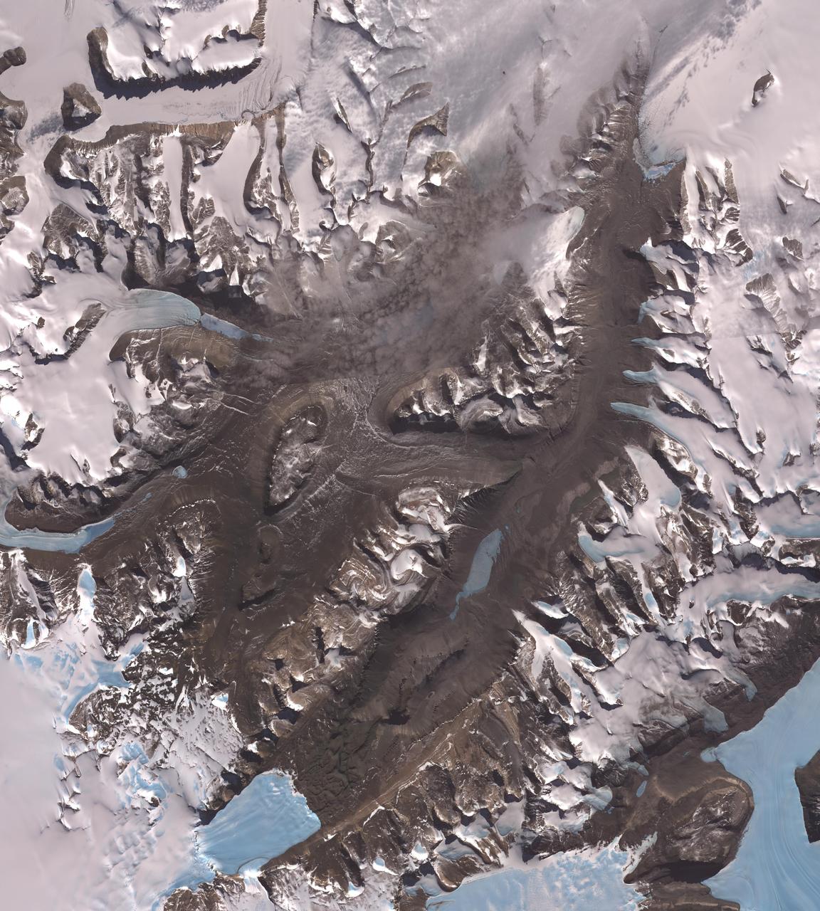 The McMurdo Dry Valleys are a row of valleys west of McMurdo Sound, Antarctica. They are so named because of their extremely low humidity and lack of snow and ice cover. This image was acquired December 8, 2002 by NASA Terra spacecraft.
