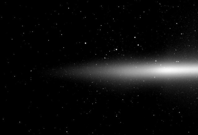 NASA Cassini spacecraft takes a look at Saturn diffuse E ring which is formed from icy material spewing out of the south pole of the moon Enceladus. The E ring is seen nearly edge-on from slightly above the northern side of Saturn ring plane.