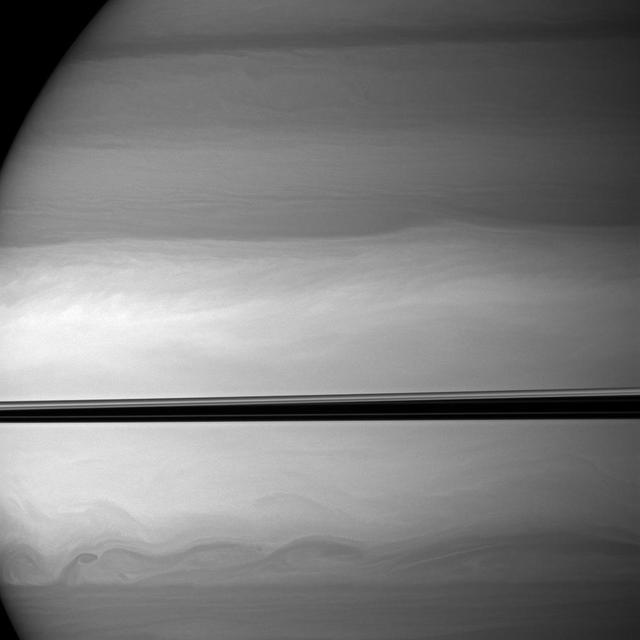 NASA Cassini spacecraft watches as clouds swirl through Saturn equatorial latitudes.