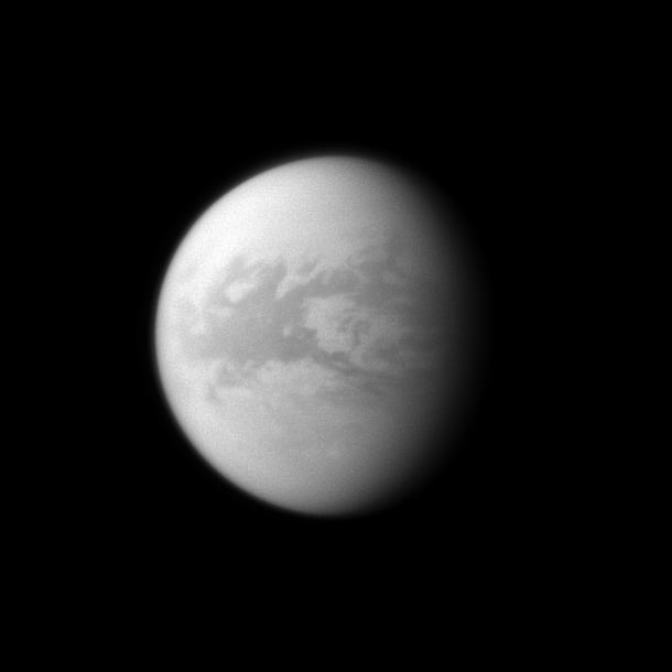 NASA Cassini spacecraft looks toward the dark region of Belet on Saturn largest moon, Titan. This large region on the moon has a low albedo, meaning it diffusely reflects little light.