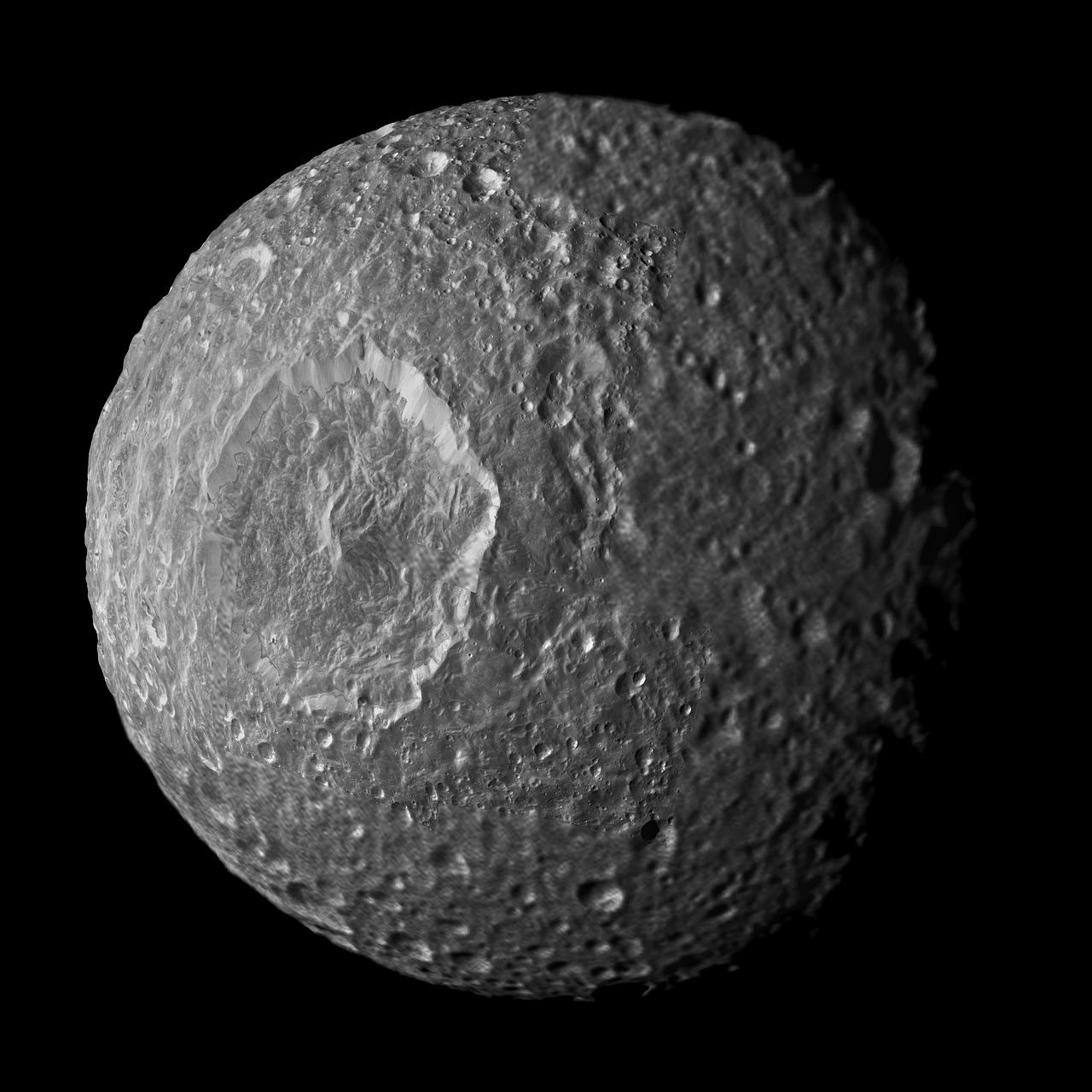Relatively dark regions below bright crater walls and streaks on some of the walls are seen in this mosaic of Saturn moon Mimas, created from images taken by NASA Cassini spacecraft during its closest flyby of the moon.