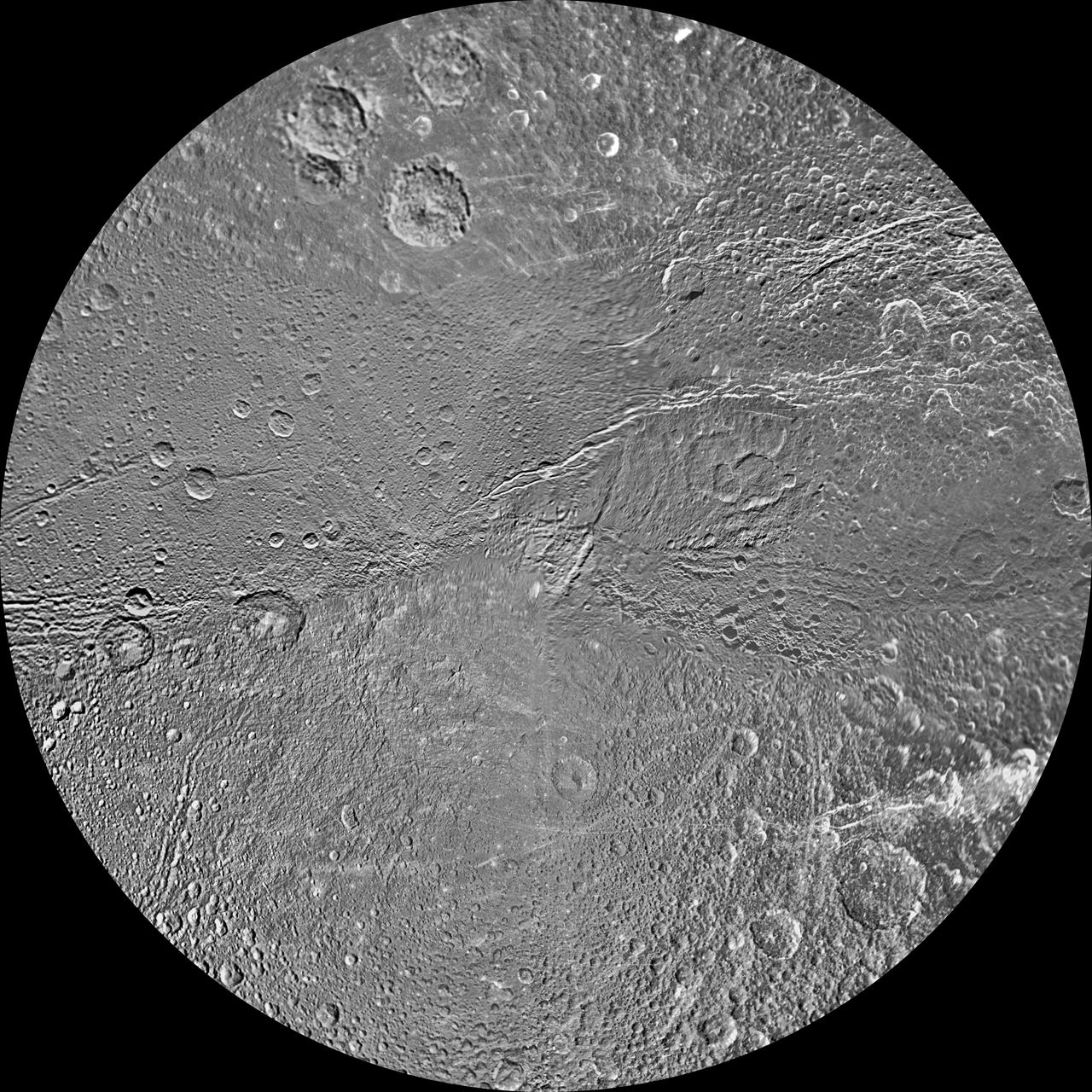 The southern hemisphere of Saturn moon Dione is seen in this polar stereographic maps, mosaicked from the best-available clear-filter images from NASA Cassini and Voyager missions.