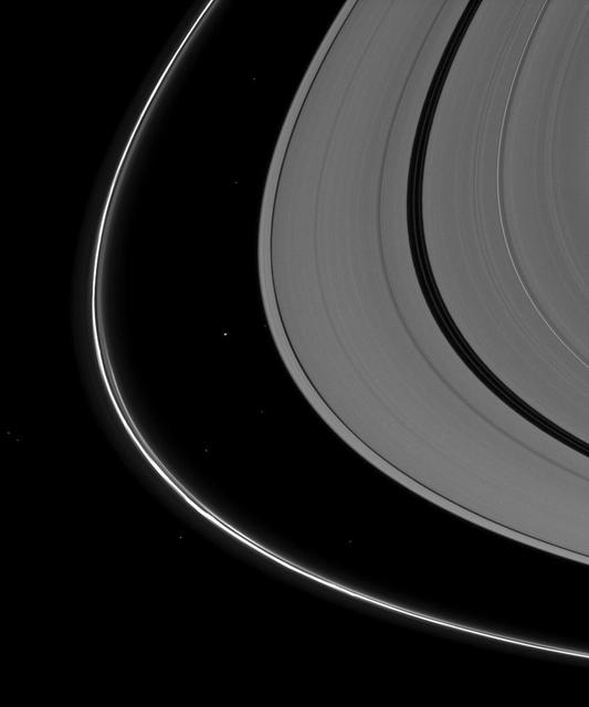 Saturn tiny moon Atlas, just to the left of the center of the image, appears almost indistinguishable from the background stars seen in this image captured by NASA Cassini spacecraft.