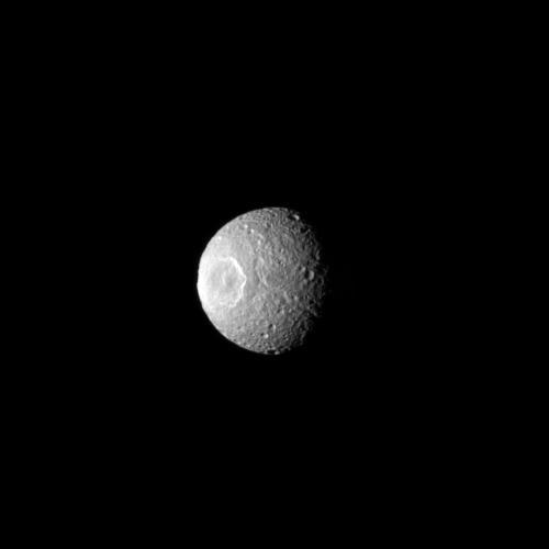 Herschel Crater features prominently on the moon Mimas in this NASA Cassini spacecraft image, which gives the impression of an eye staring out into space.