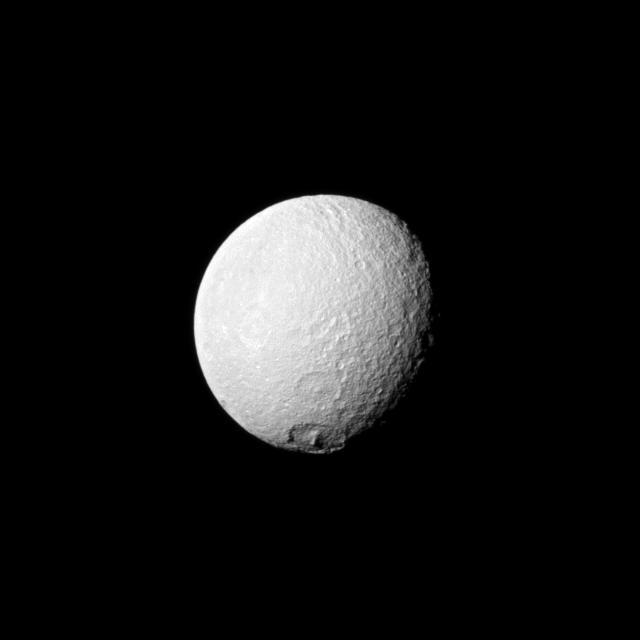 NASA Cassini spacecraft looks toward an area between the trailing hemisphere and anti-Saturn side of Tethys and spies the large crater Melanthius near the moon south pole.